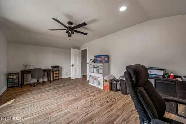 a bed room with a bed and a chair