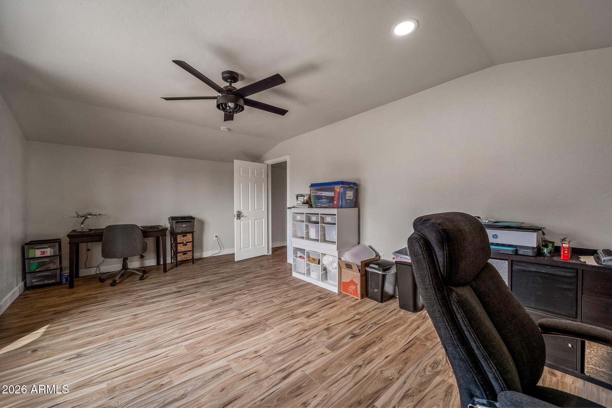 2270 Spitfire Circle Overgaard, AZ 85933 - Photo 32 of 47 a bed room with a bed and a chair