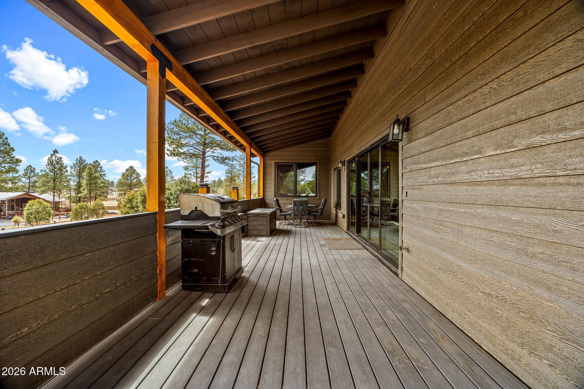 2270 Spitfire Circle Overgaard, AZ 85933 - Photo 33 of 47 a view of a balcony with chairs and wooden floor
