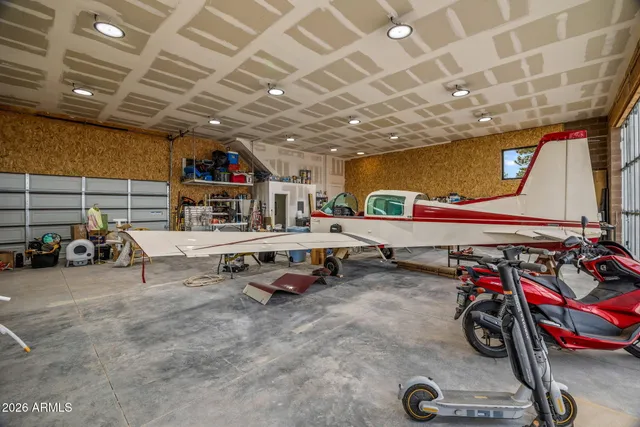 a view of parking garage with cars