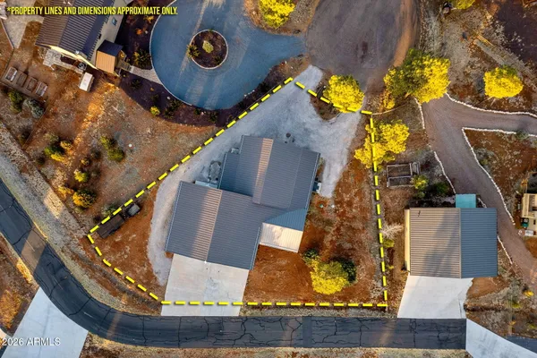 an aerial view of a house with a swimming pool
