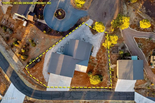 an aerial view of a house with a swimming pool