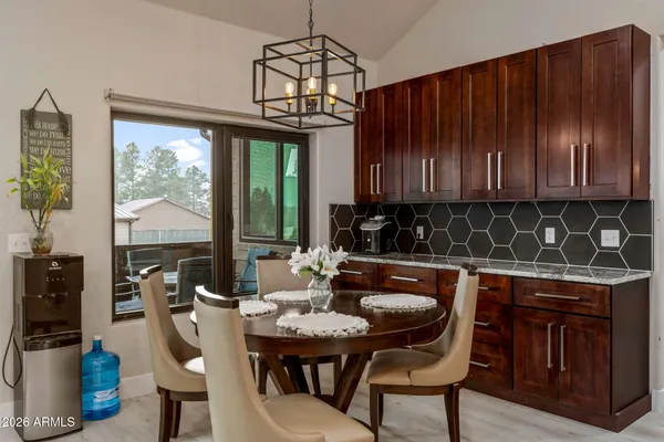 a view of a dining room with furniture window and outside view