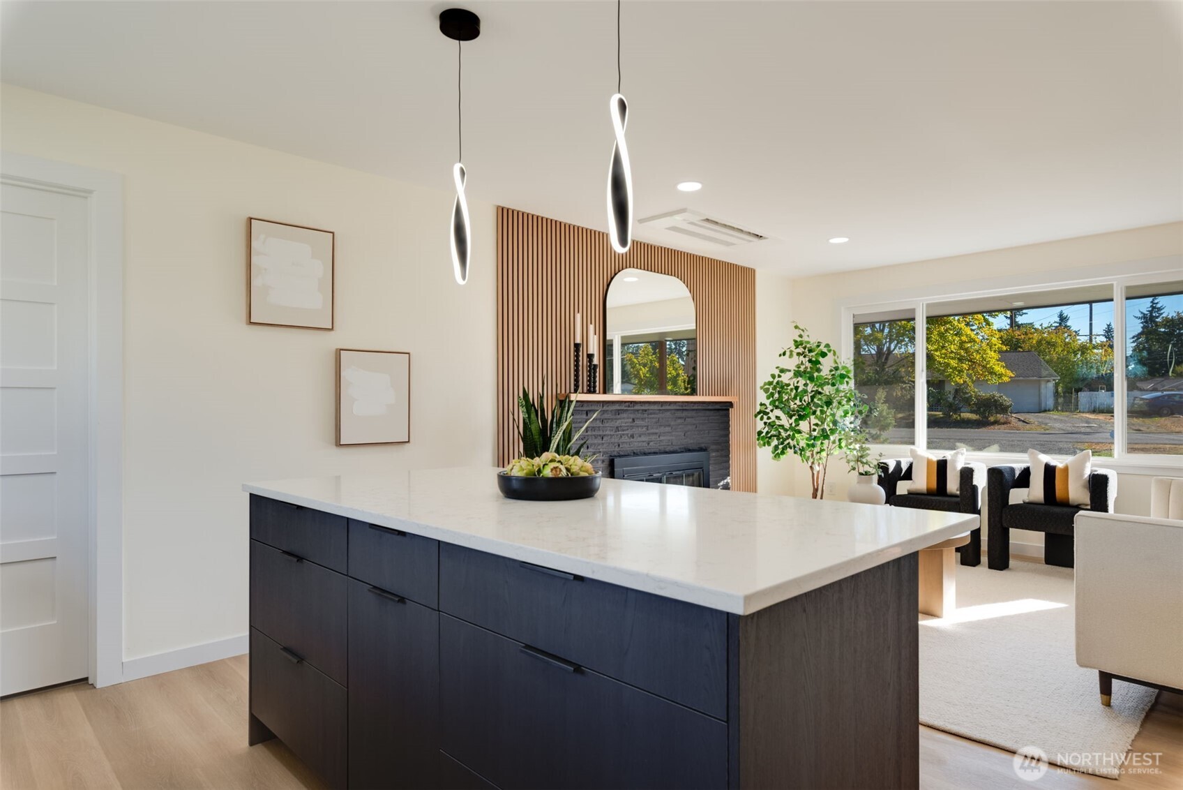 11010 Davisson Road Southwest Lakewood, WA 98499 - Photo 11 of 40 a kitchen with a sink a counter top space and living room view