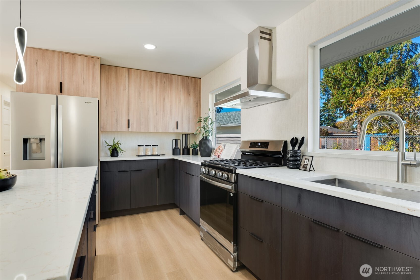 11010 Davisson Road Southwest Lakewood, WA 98499 - Photo 12 of 40 a kitchen with stainless steel appliances a sink stove and refrigerator