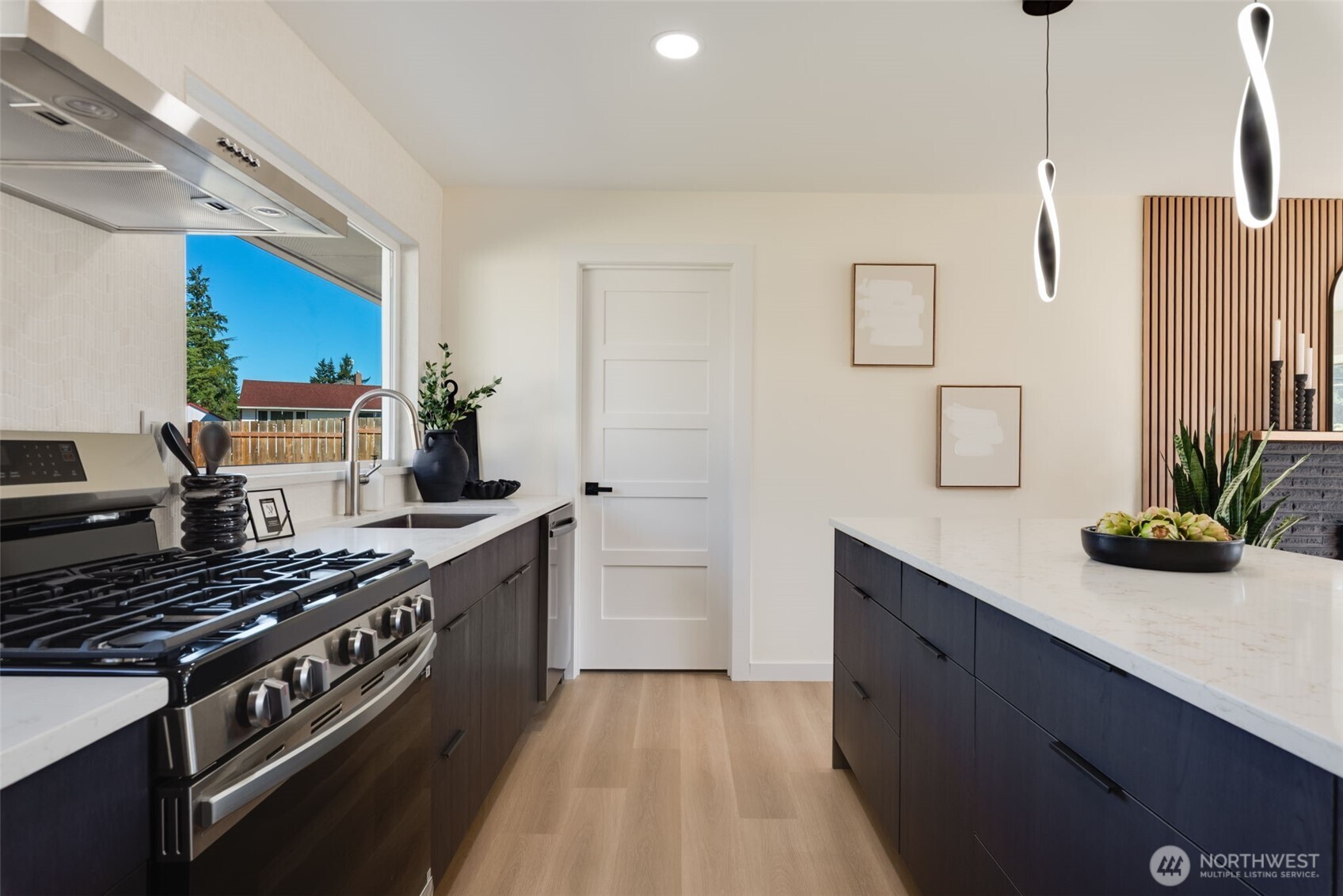 11010 Davisson Road Southwest Lakewood, WA 98499 - Photo 15 of 40 a kitchen with a stove and a sink