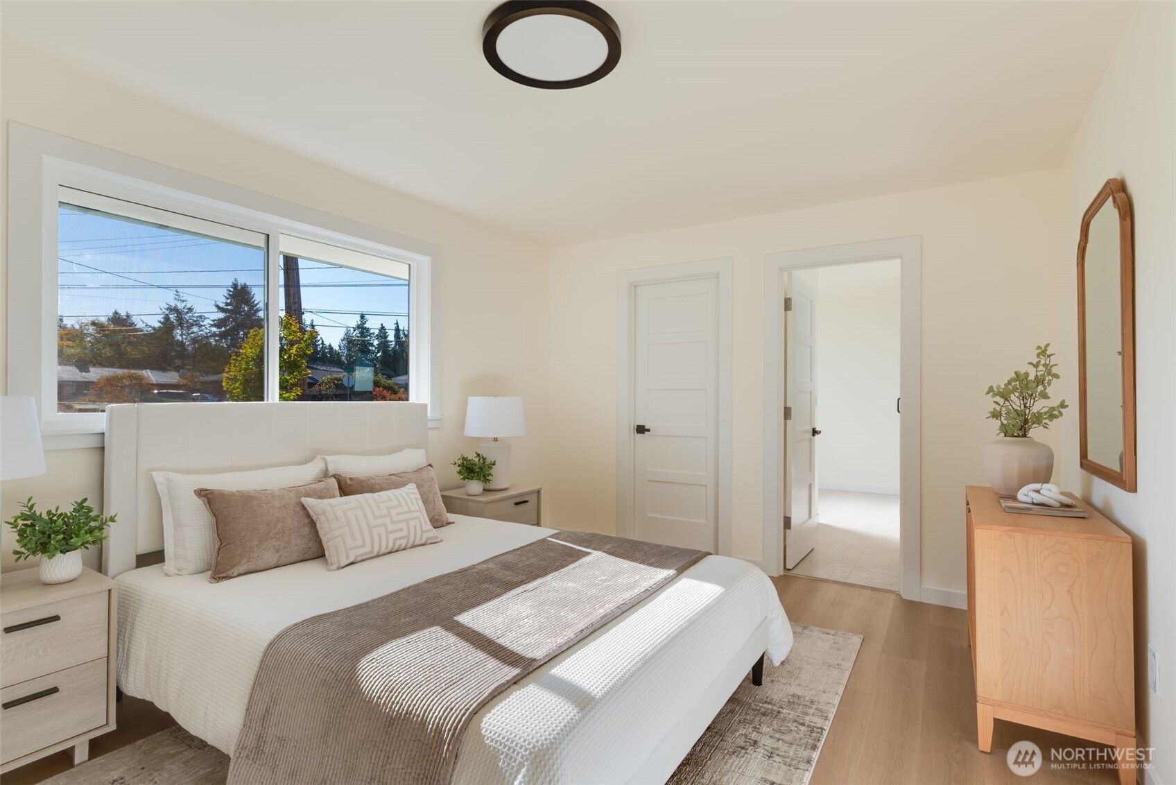 11010 Davisson Road Southwest Lakewood, WA 98499 - Photo 17 of 40 a bedroom with a bed and a painting on the wall