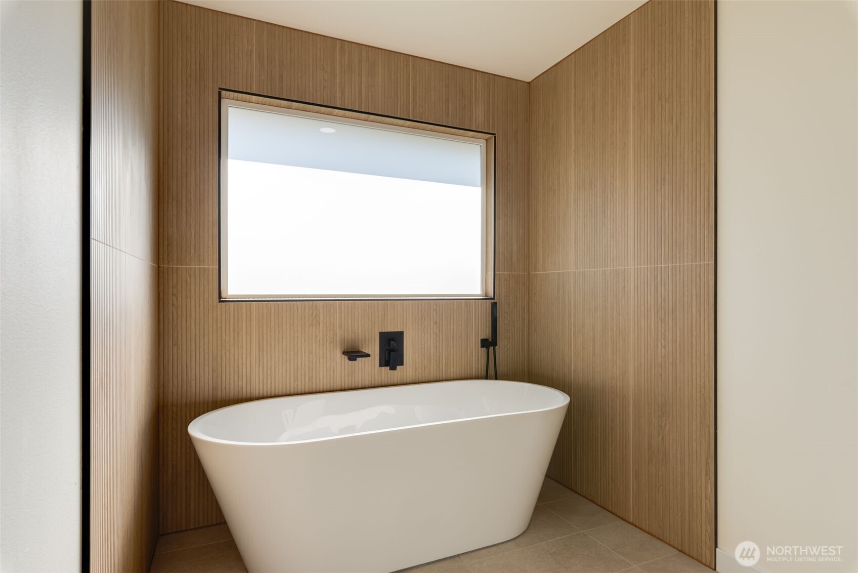 11010 Davisson Road Southwest Lakewood, WA 98499 - Photo 21 of 40 a white bath tub sitting in a bathroom