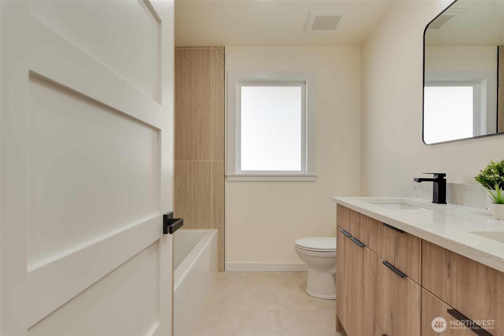 11010 Davisson Road Southwest Lakewood, WA 98499 - Photo 27 of 40 a bathroom with a sink a toilet and shower