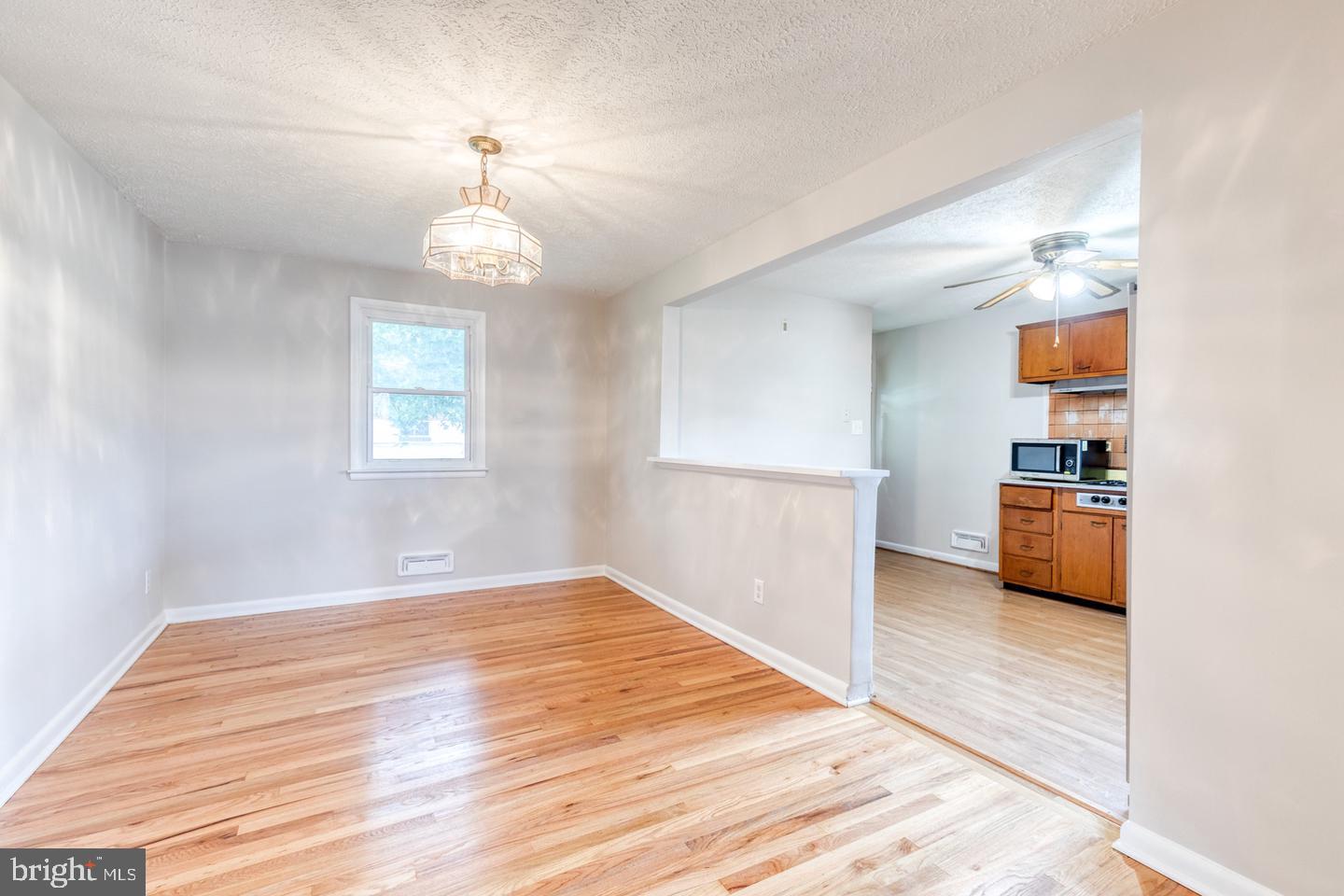 8306 Berkfield Road Baltimore, MD 21237 - Photo 10 of 29 Bright and airy open dining space.