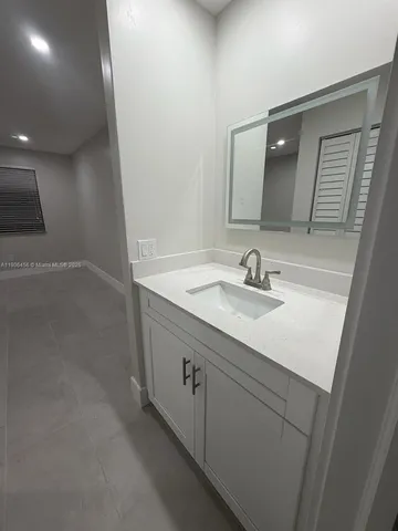 a bathroom with a sink and toilet