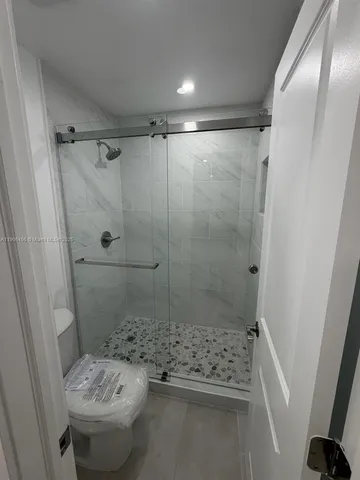 a view of a room with racks on the wall