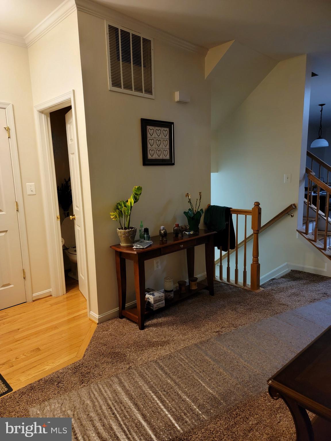 27 Riparian Lane Ranson, WV 25438 - Photo 3 of 4 View of living room/foyer beautiful hardwood floor