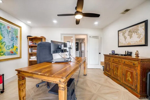 a living room with stainless steel appliances kitchen island granite countertop furniture and a kitchen view