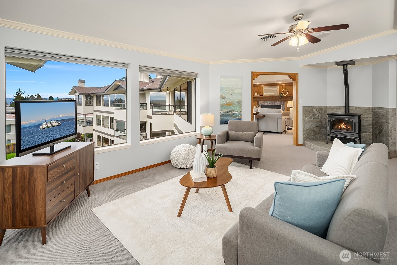 505 Pine Street, Unit 301 Edmonds, WA 98020 - Photo 14 of 40 a living room with furniture a flat screen tv and a fireplace