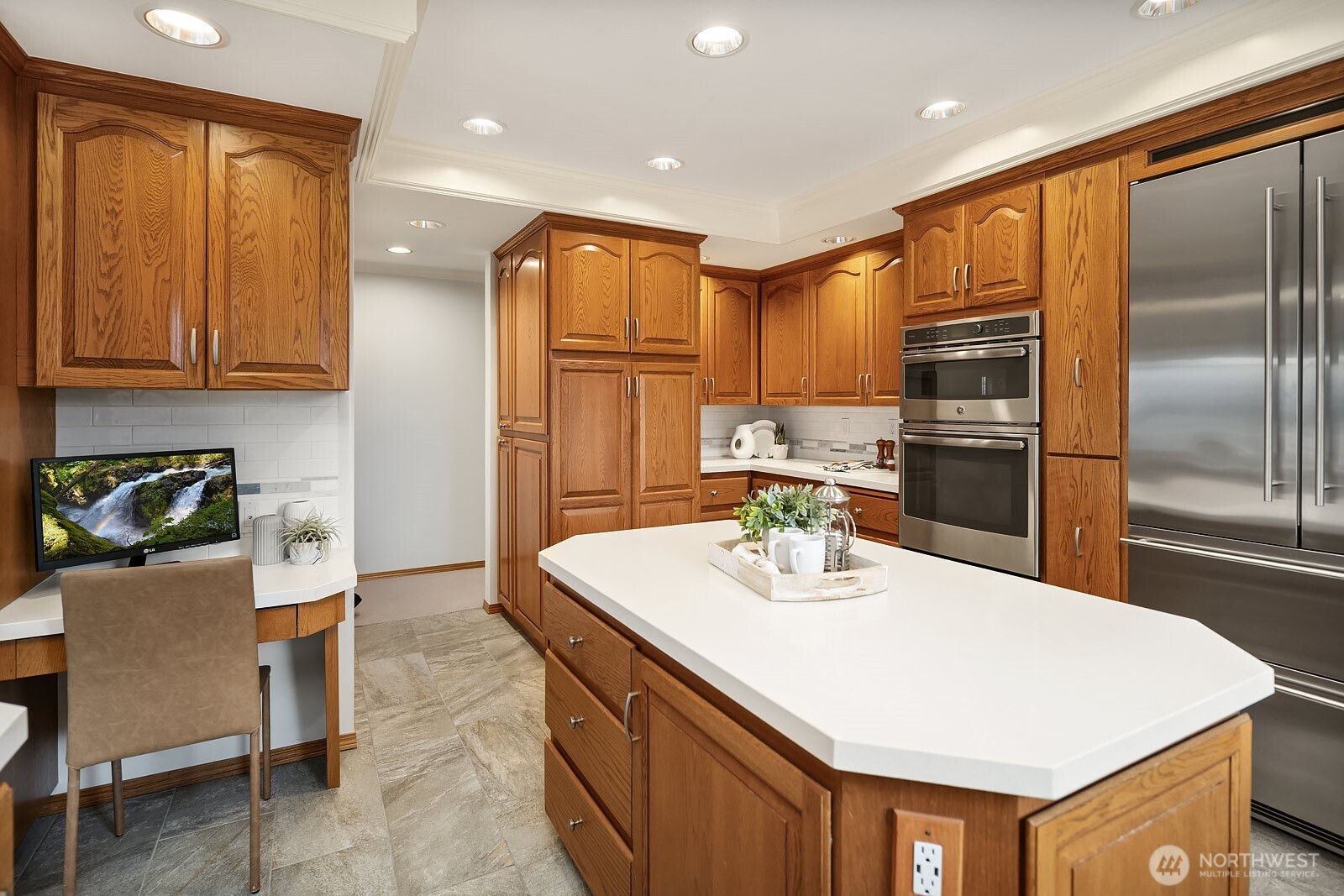 505 Pine Street, Unit 301 Edmonds, WA 98020 - Photo 21 of 40 a kitchen with kitchen island a sink stove and refrigerator