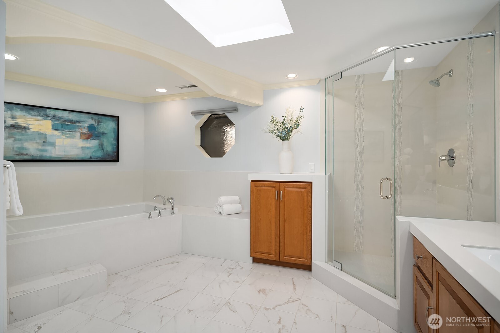 505 Pine Street, Unit 301 Edmonds, WA 98020 - Photo 26 of 40 a bathroom with a tub a sink and a shower