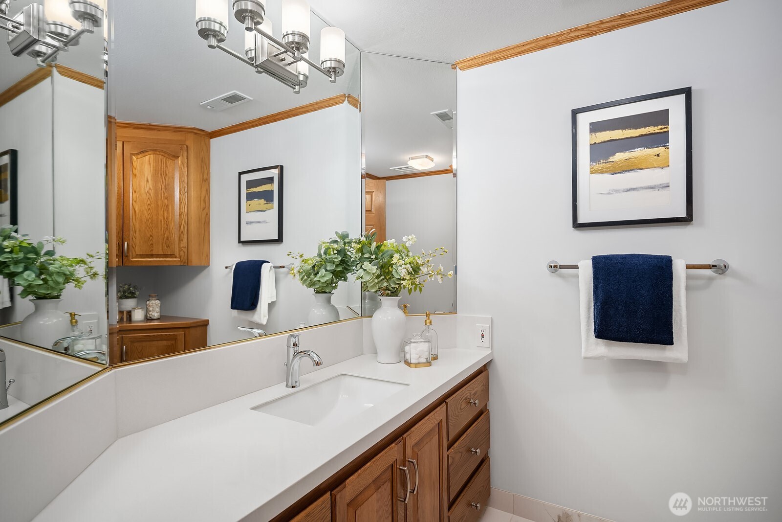 505 Pine Street, Unit 301 Edmonds, WA 98020 - Photo 27 of 40 a bathroom with a sink and a mirror