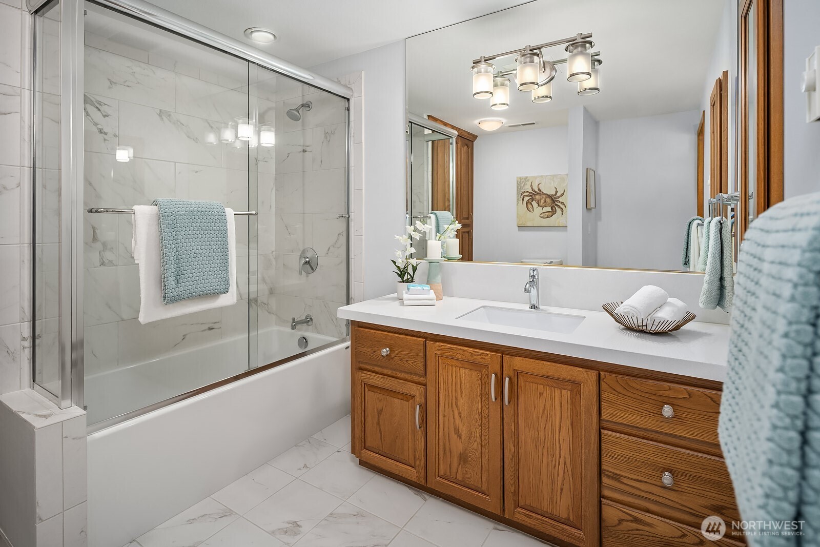 505 Pine Street, Unit 301 Edmonds, WA 98020 - Photo 29 of 40 a spacious bathroom with a granite countertop sink a toilet a mirror and shower