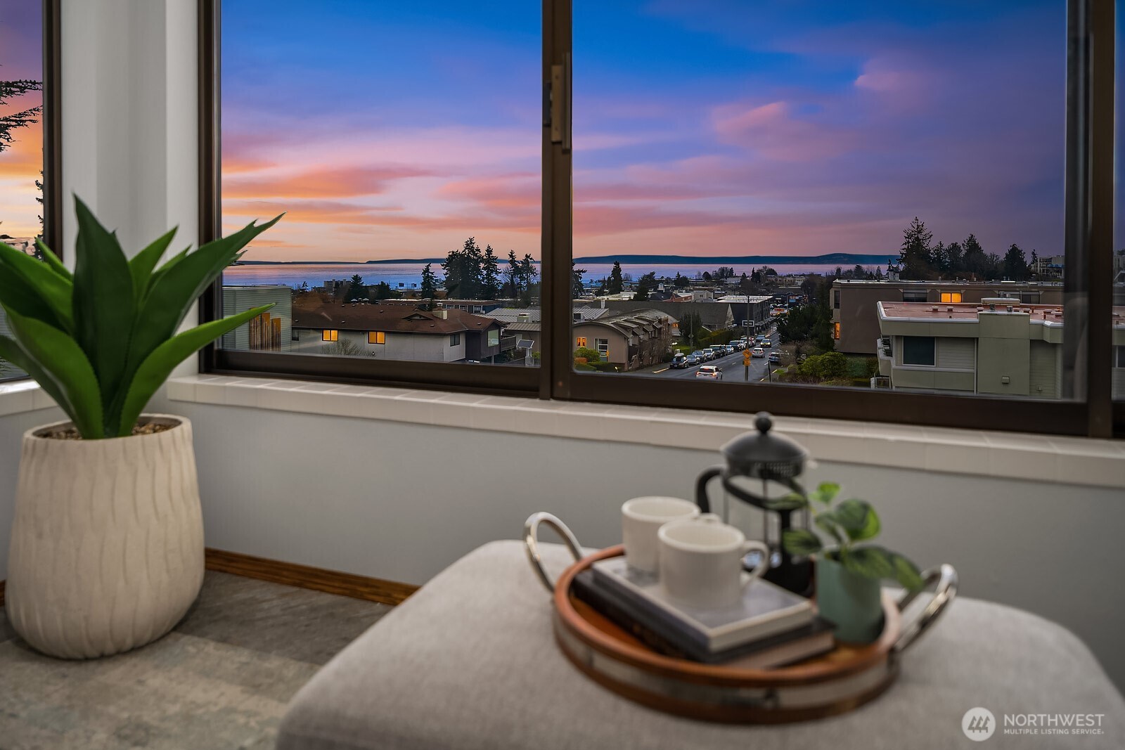 505 Pine Street, Unit 301 Edmonds, WA 98020 - Photo 36 of 40 a view of a balcony with chair and a potted plant