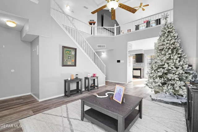a living room with furniture and a potted plant