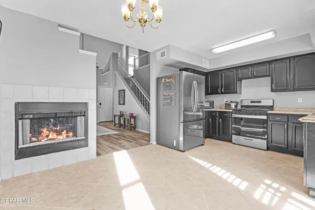 a kitchen with cabinets and steel stainless steel appliances