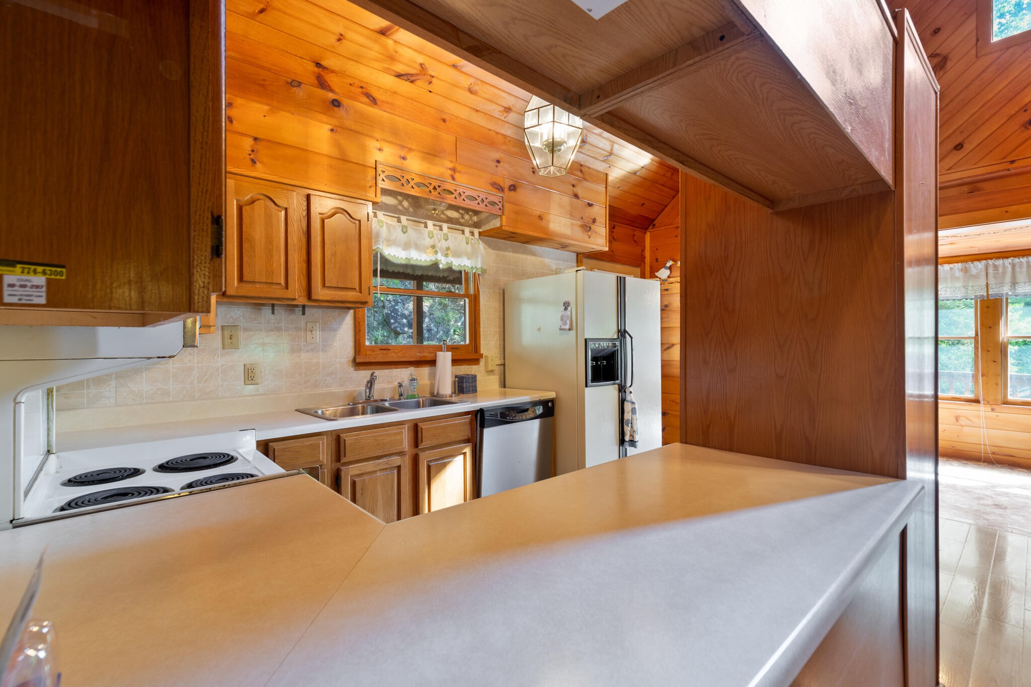 1724 Red Fox Ridge Way Sevierville, TN 37862 - Photo 14 of 59 a kitchen with stainless steel appliances granite countertop a sink and a refrigerator