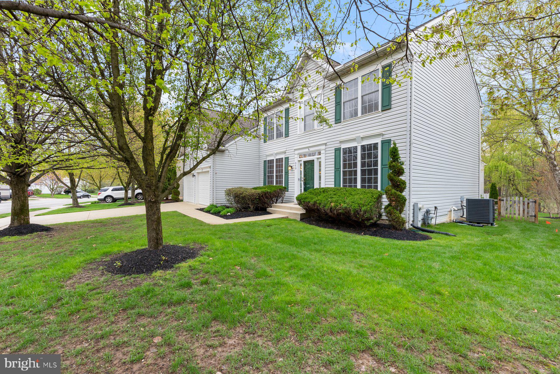 850 Sunny Chapel Road Odenton, MD 21113 - Photo 3 of 53 a front view of a house with a garden and trees