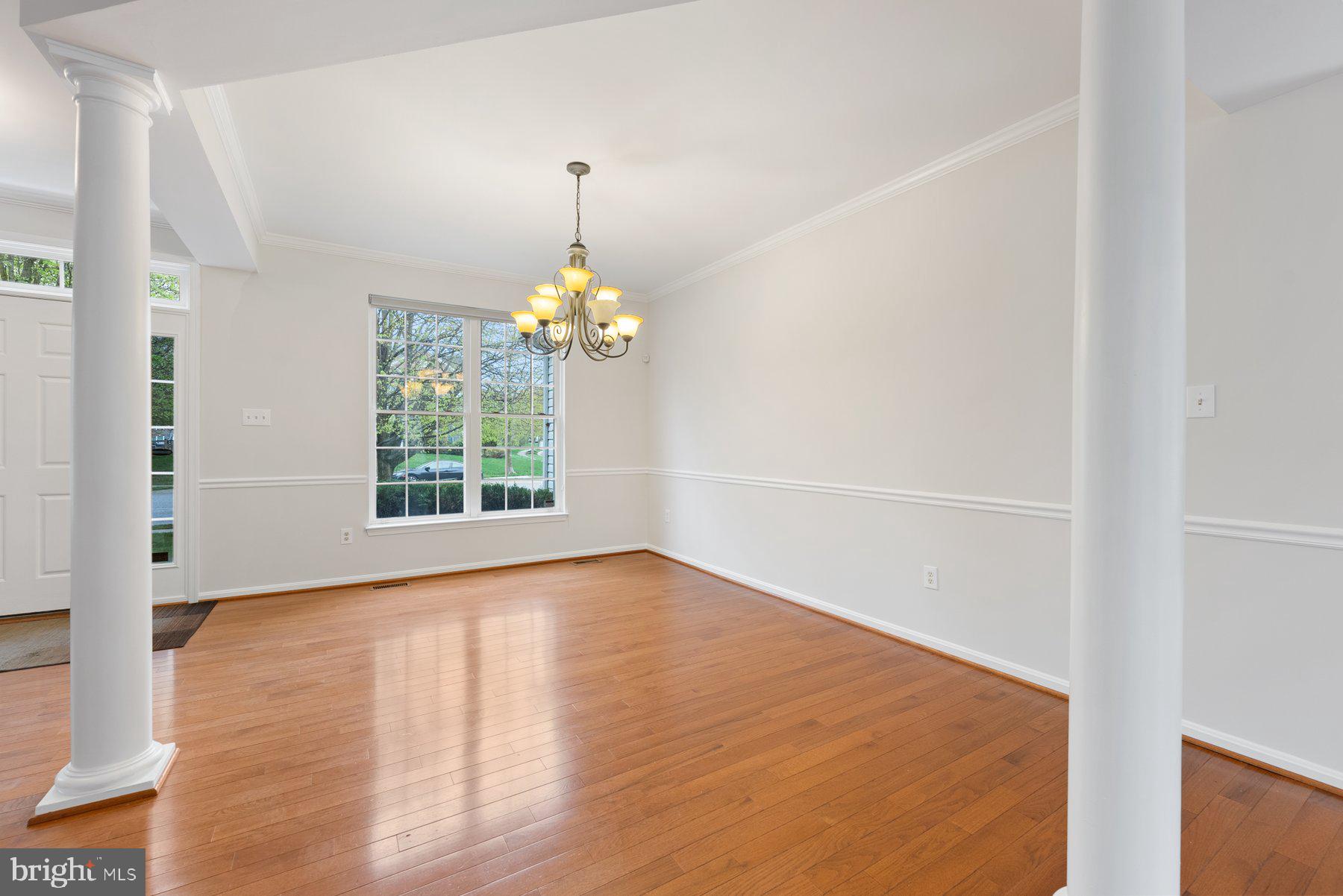 850 Sunny Chapel Road Odenton, MD 21113 - Photo 6 of 53 a view of an empty room with window and wooden floor