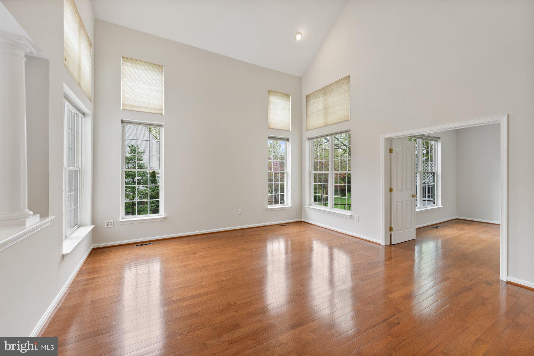 850 Sunny Chapel Road Odenton, MD 21113 - Photo 10 of 53 a view of an empty room with wooden floor and a window