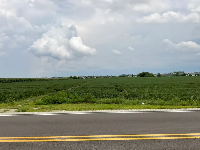 a view of a golf course with swimming pool