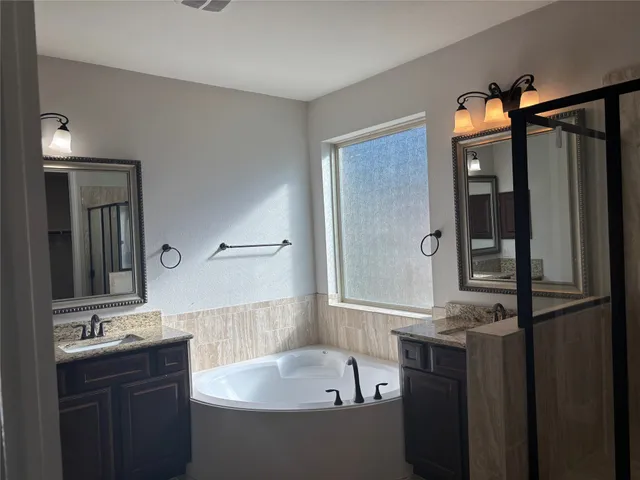 a bathroom with a bathtub and a sink
