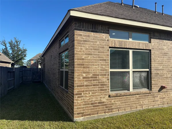 a view of a back yard of the house