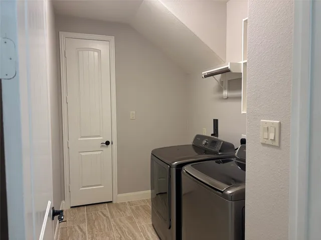 a view of a storage and utility room with a sink