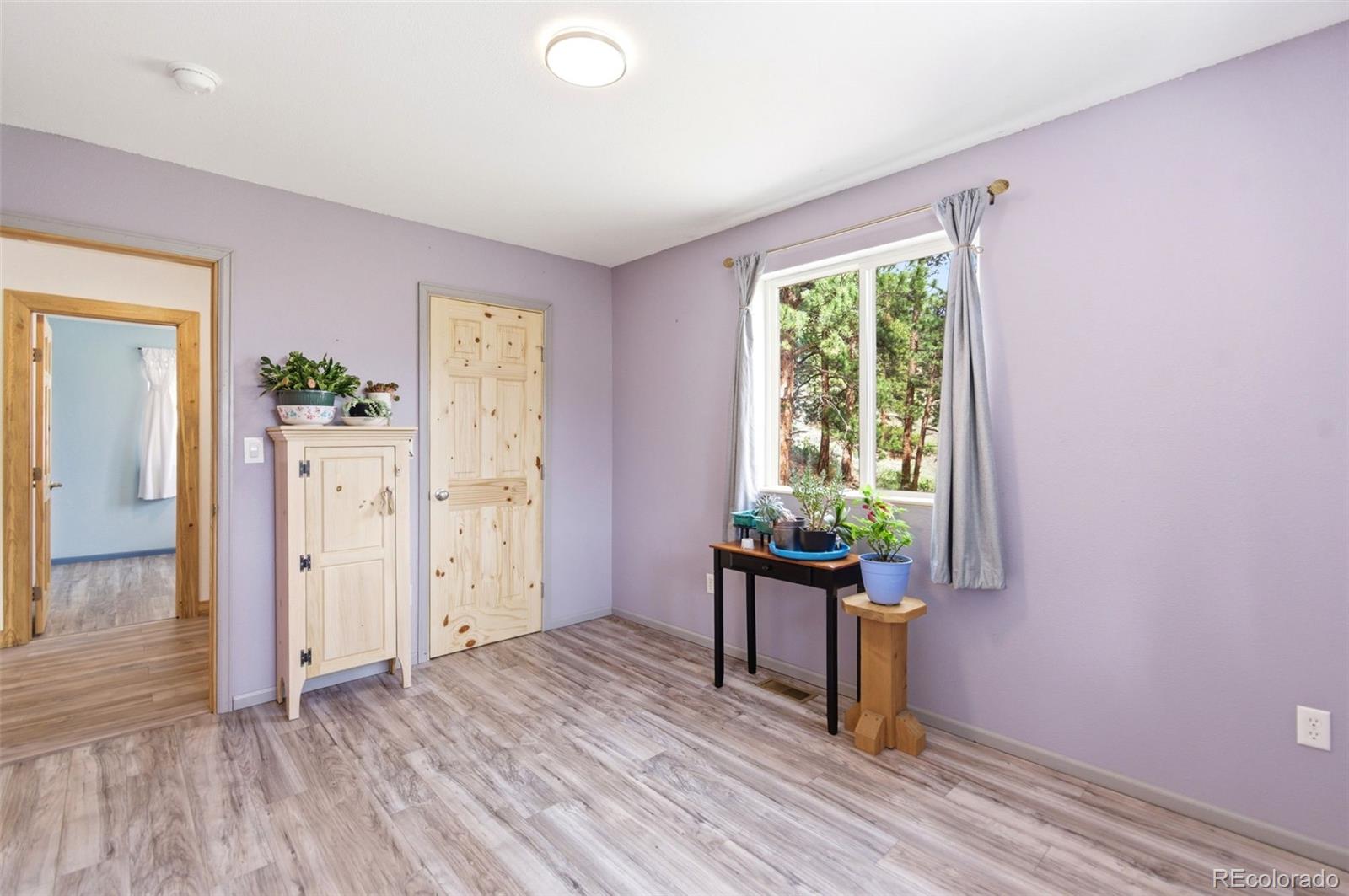 202 Badger Lane Bailey, CO 80421 - Photo 32 of 50 wooden floor in an empty room with a window