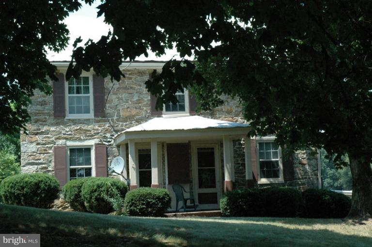 8302 Mapleville Road Mount Airy, MD 21771 - Photo 4 of 21 front view of a house with a yard