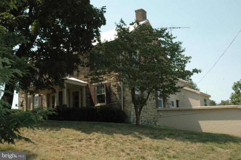8302 Mapleville Road Mount Airy, MD 21771 - Photo 5 of 21 a view of a house with a tree