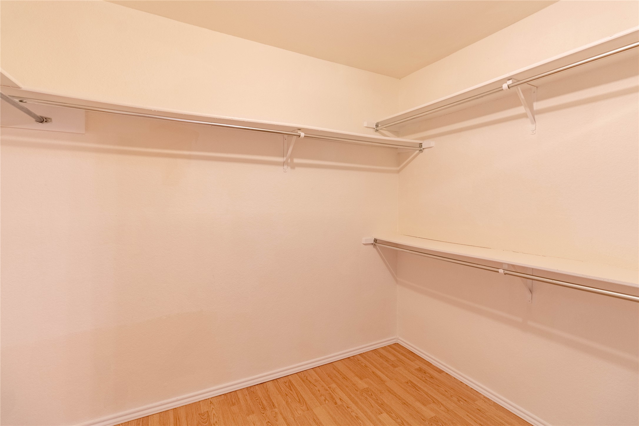 3809 Spicewood Springs Road, Unit 253 Austin, TX 78759 - Photo 17 of 23 Walk in closet featuring light wood finished floors
