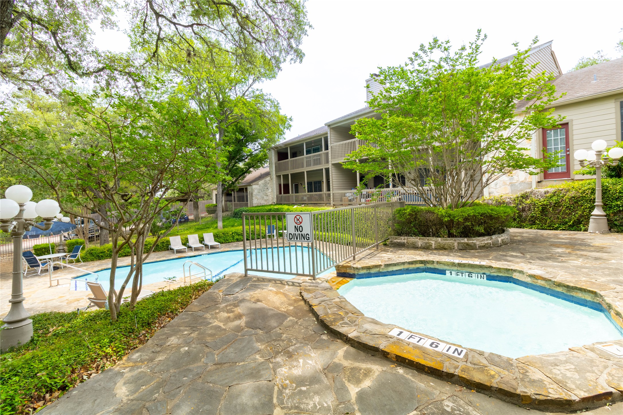 3809 Spicewood Springs Road, Unit 253 Austin, TX 78759 - Photo 20 of 23 Community pool with a patio and a hot tub