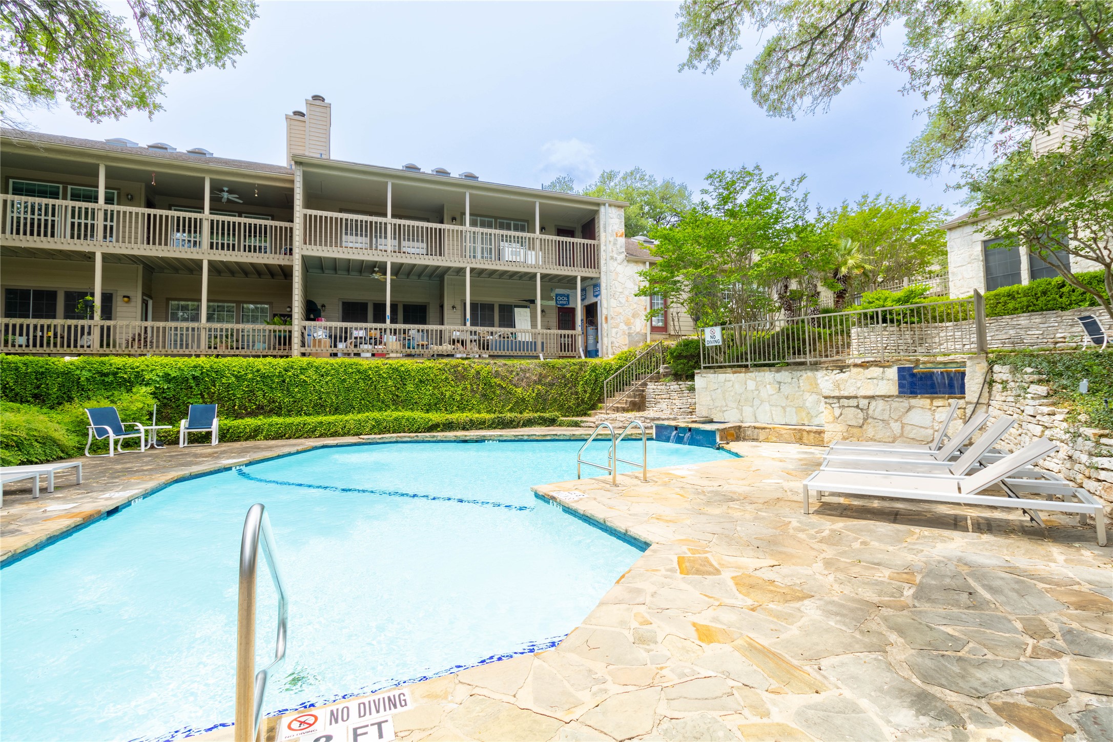 3809 Spicewood Springs Road, Unit 253 Austin, TX 78759 - Photo 21 of 23 Community pool featuring a patio area and a balcony