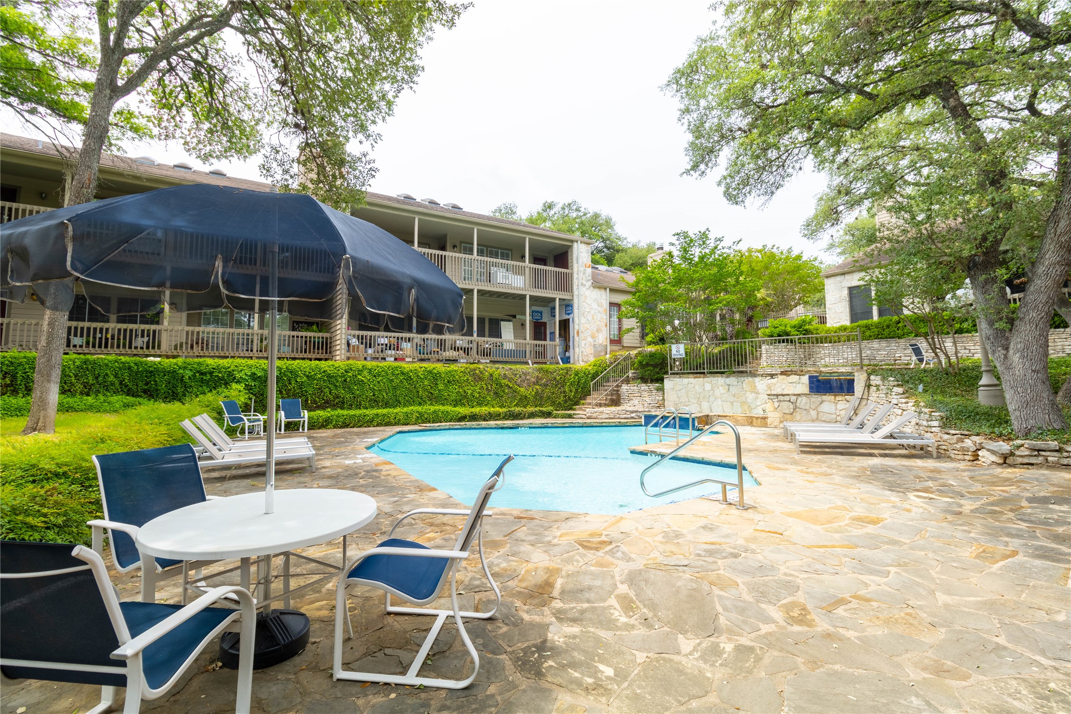 3809 Spicewood Springs Road, Unit 253 Austin, TX 78759 - Photo 22 of 23 Community pool with a patio