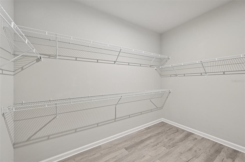 20280 Concerto Place Venice, FL 34293 - Photo 17 of 37 a view of a room with racks on the wall