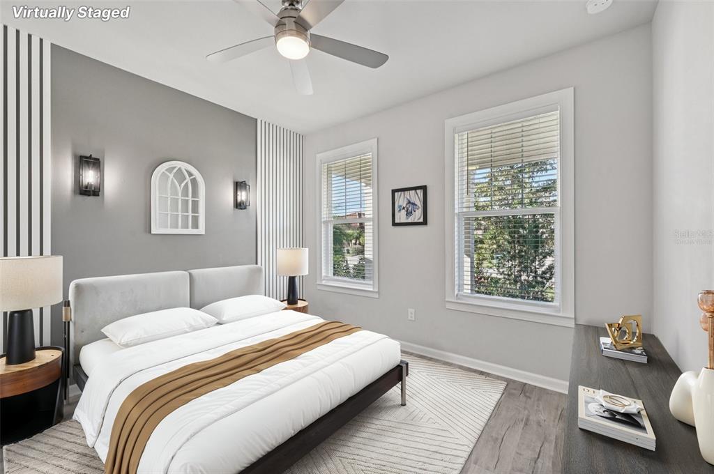 20280 Concerto Place Venice, FL 34293 - Photo 18 of 37 a bedroom with a bed and wooden floor