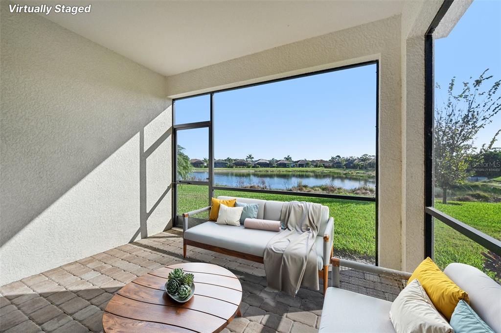 20280 Concerto Place Venice, FL 34293 - Photo 2 of 37 a living room with furniture and a floor to ceiling window