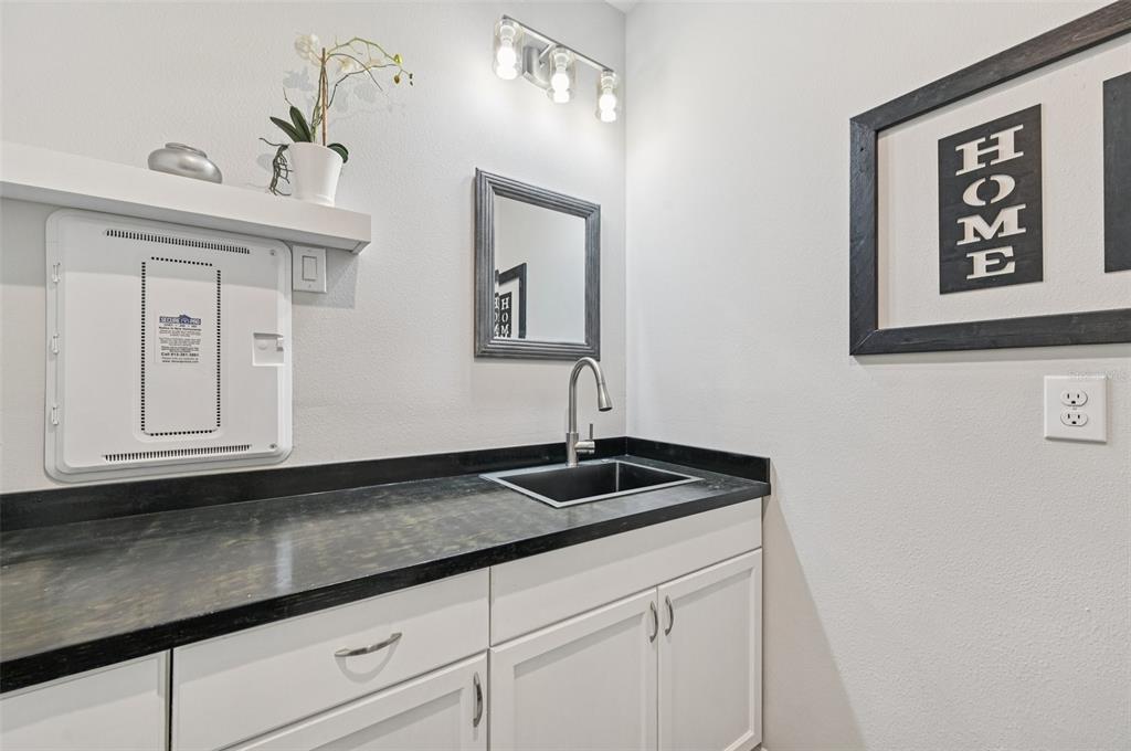 20280 Concerto Place Venice, FL 34293 - Photo 26 of 37 a kitchen with sink and cabinets