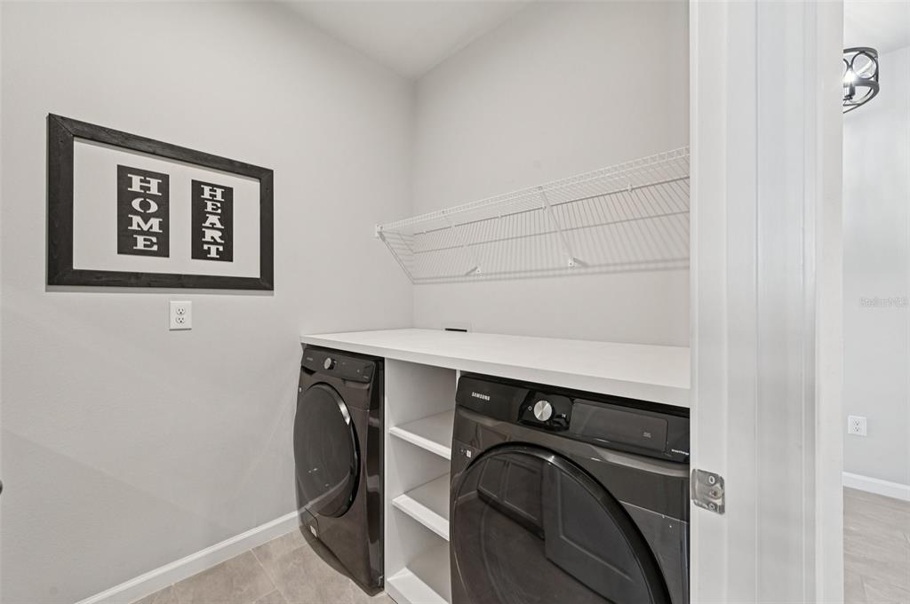 20280 Concerto Place Venice, FL 34293 - Photo 27 of 37 a utility room with dryer and washer