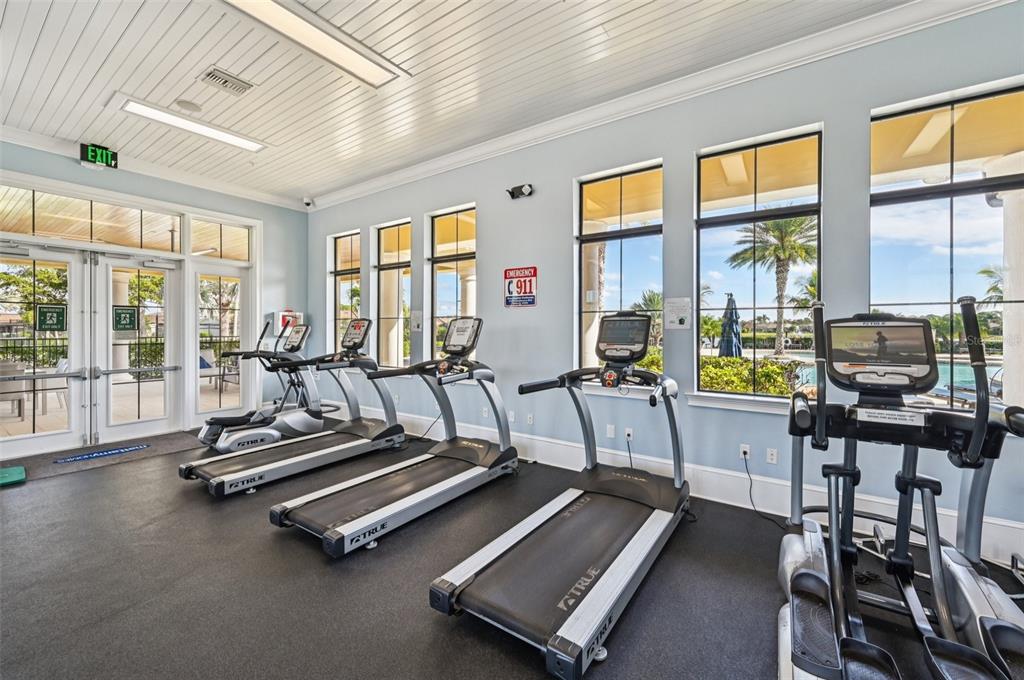 20280 Concerto Place Venice, FL 34293 - Photo 32 of 37 a room with gym equipment and floor to ceiling windows