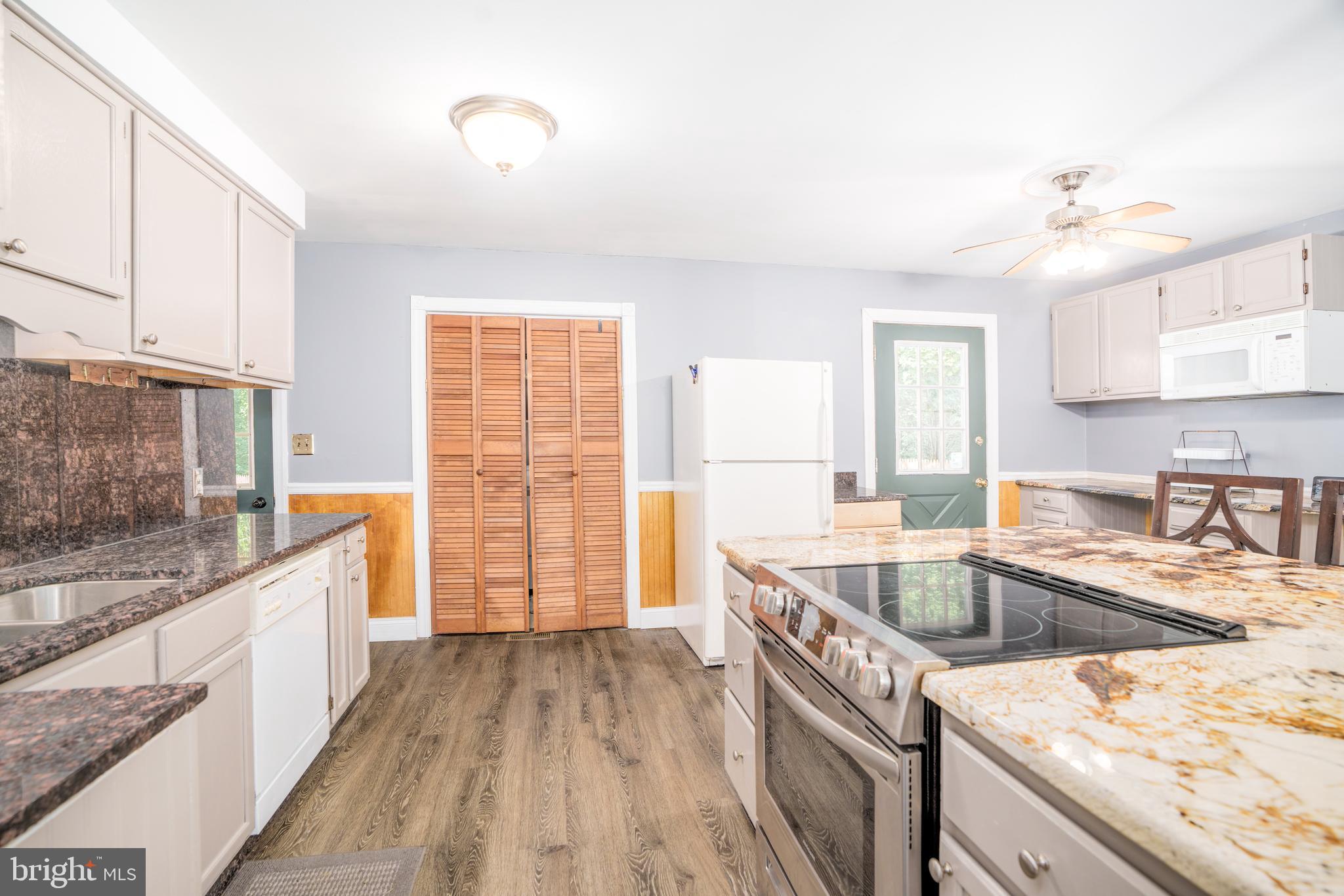 Kitchen with electric range in the island