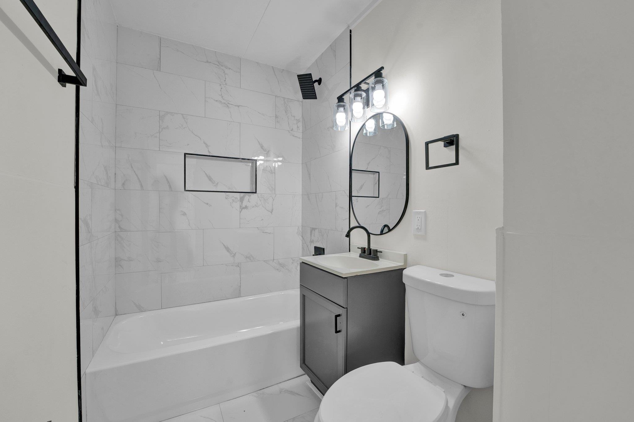 7829 Admiral Road Millington, TN 38053 - Photo 18 of 28 Full bathroom with vanity, toilet, and tiled shower / bath