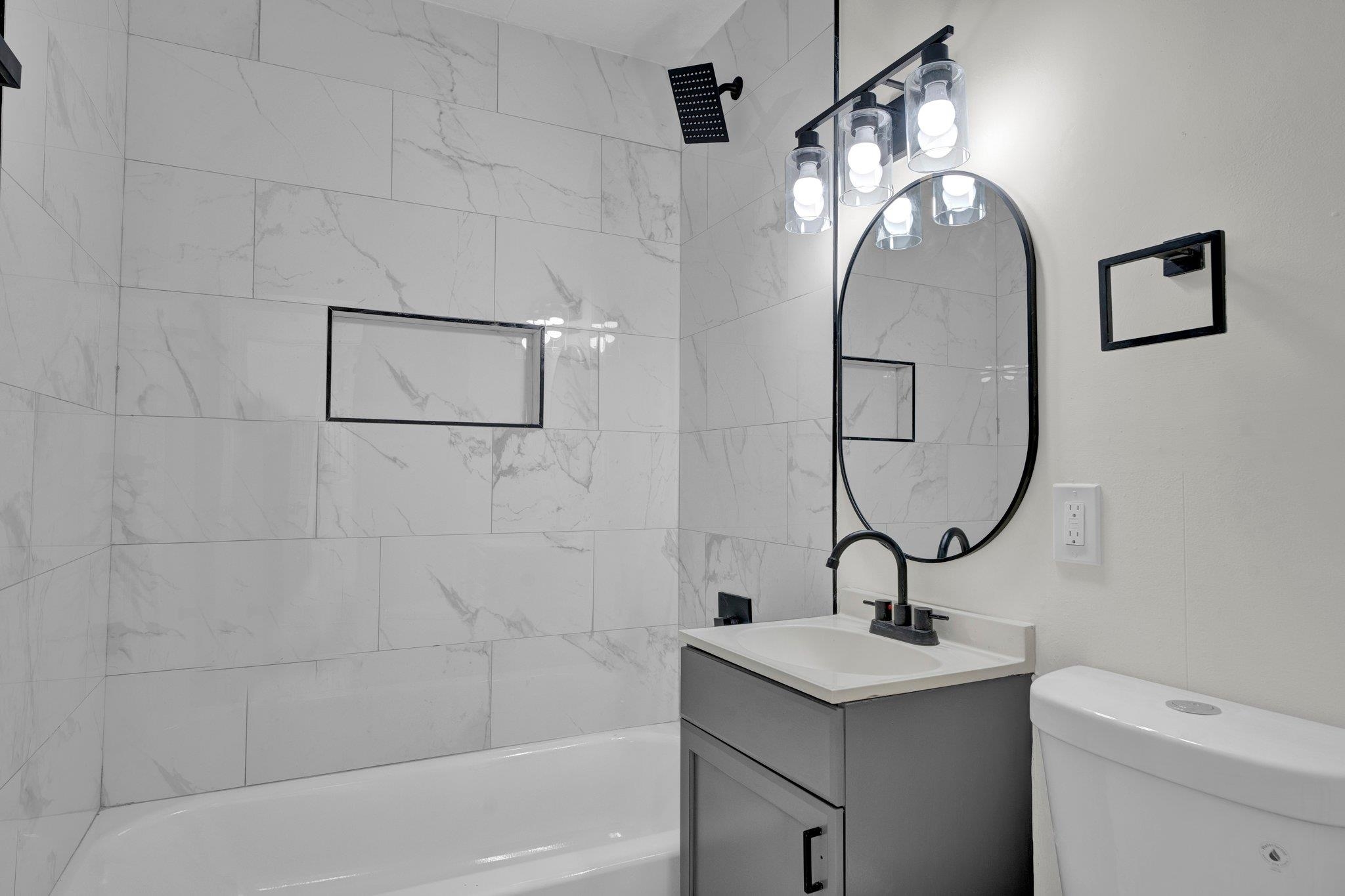 7829 Admiral Road Millington, TN 38053 - Photo 19 of 28 Full bathroom featuring tiled shower / bath, toilet, and vanity